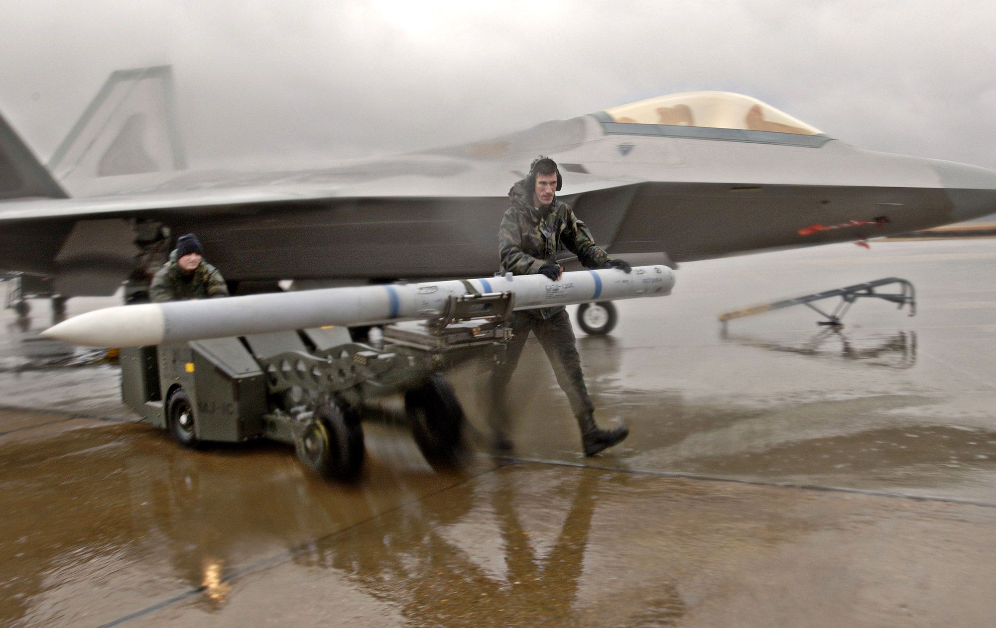 M120 AIM-9 missile and an F-22A Raptor
