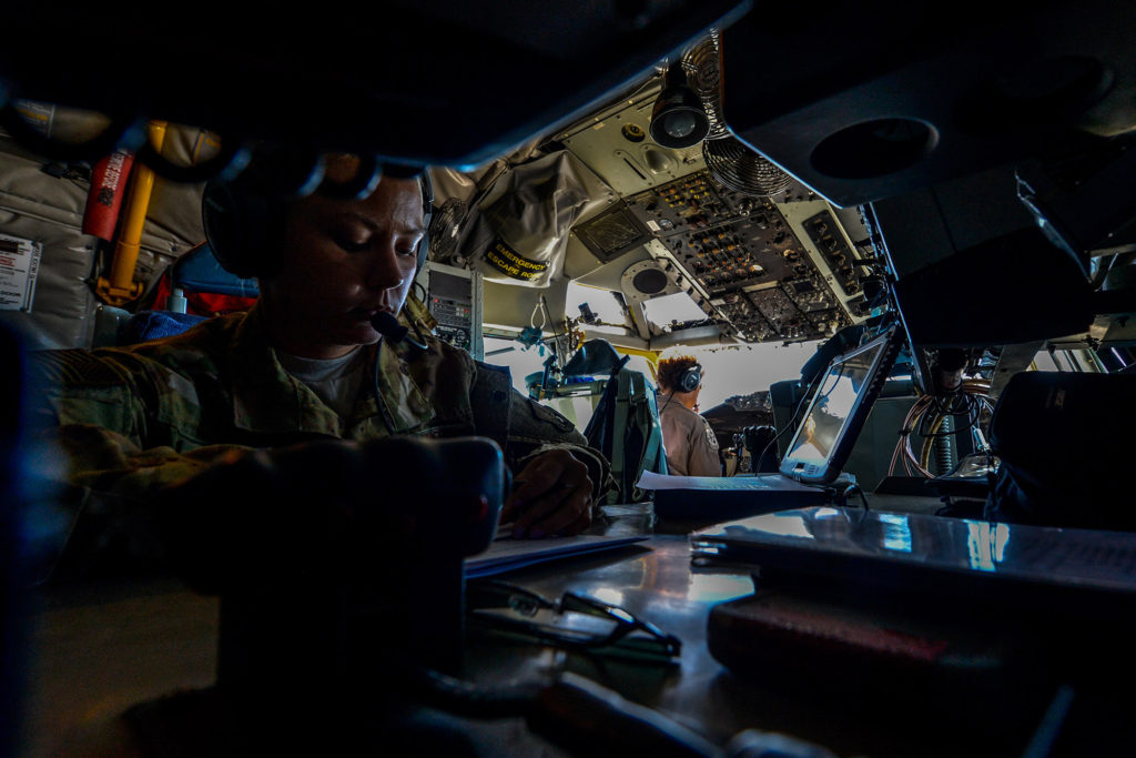 USAF boom operator reviews refueling documents