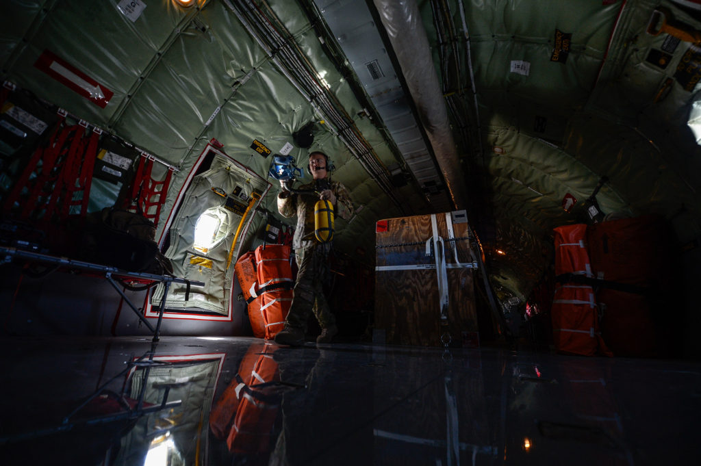 Boom operator walks through a KC-135 Stratotanker
