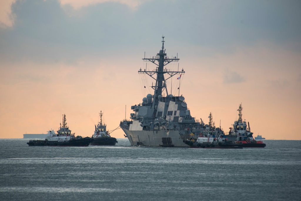 USS John S. McCain towed for transport