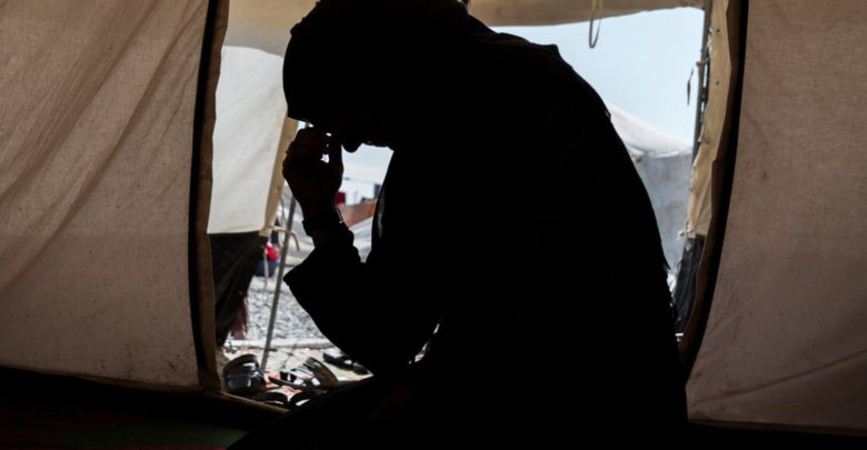 Zahra, whose husband was an ISIS fighter, sits in a camp for internally displaced people in Iraq