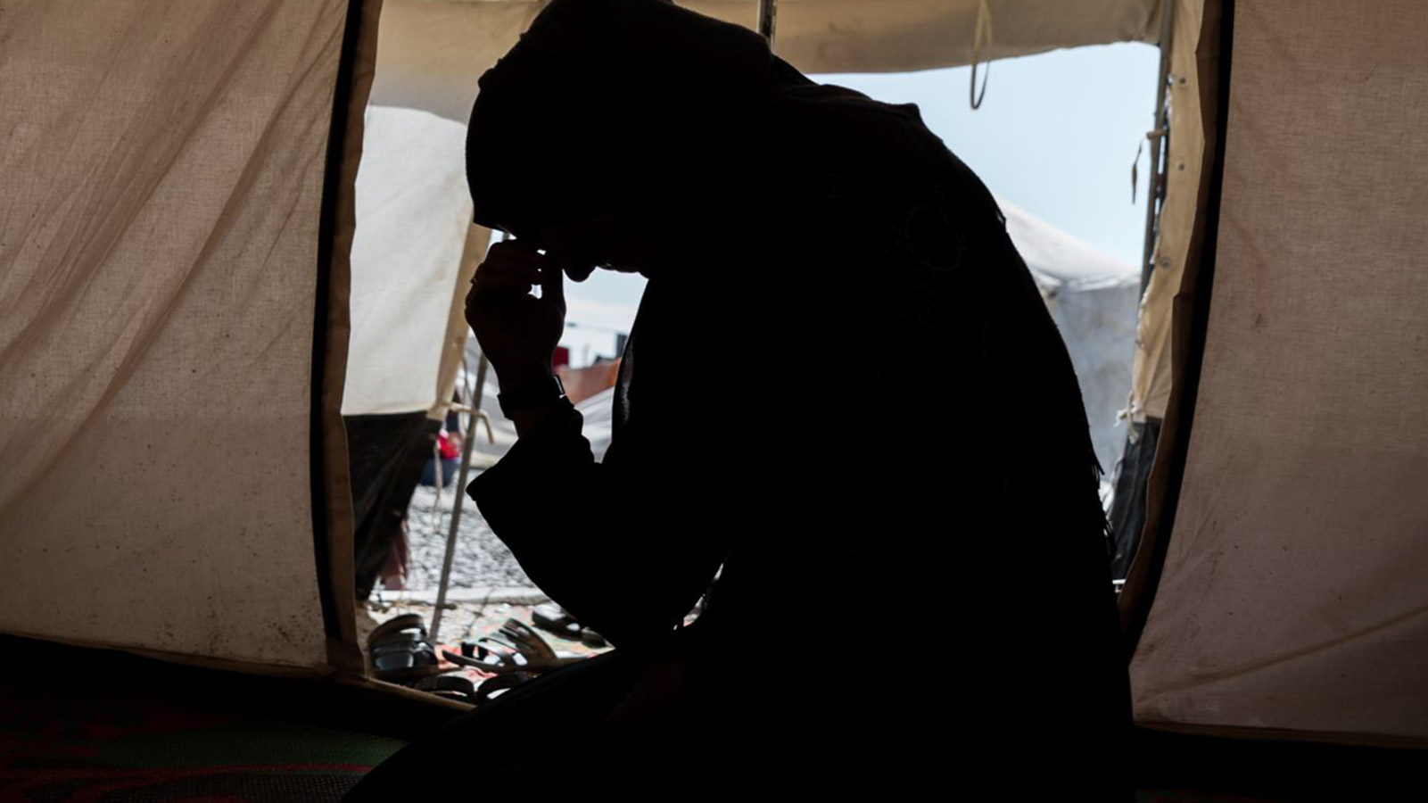 Zahra, whose husband was an ISIS fighter, sits in a camp for internally displaced people in Iraq