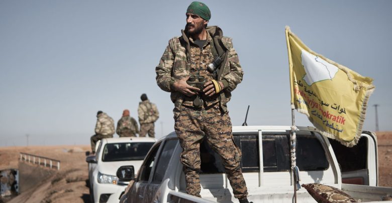 An SDF commander prepares his unit to enter Tal al-Samam