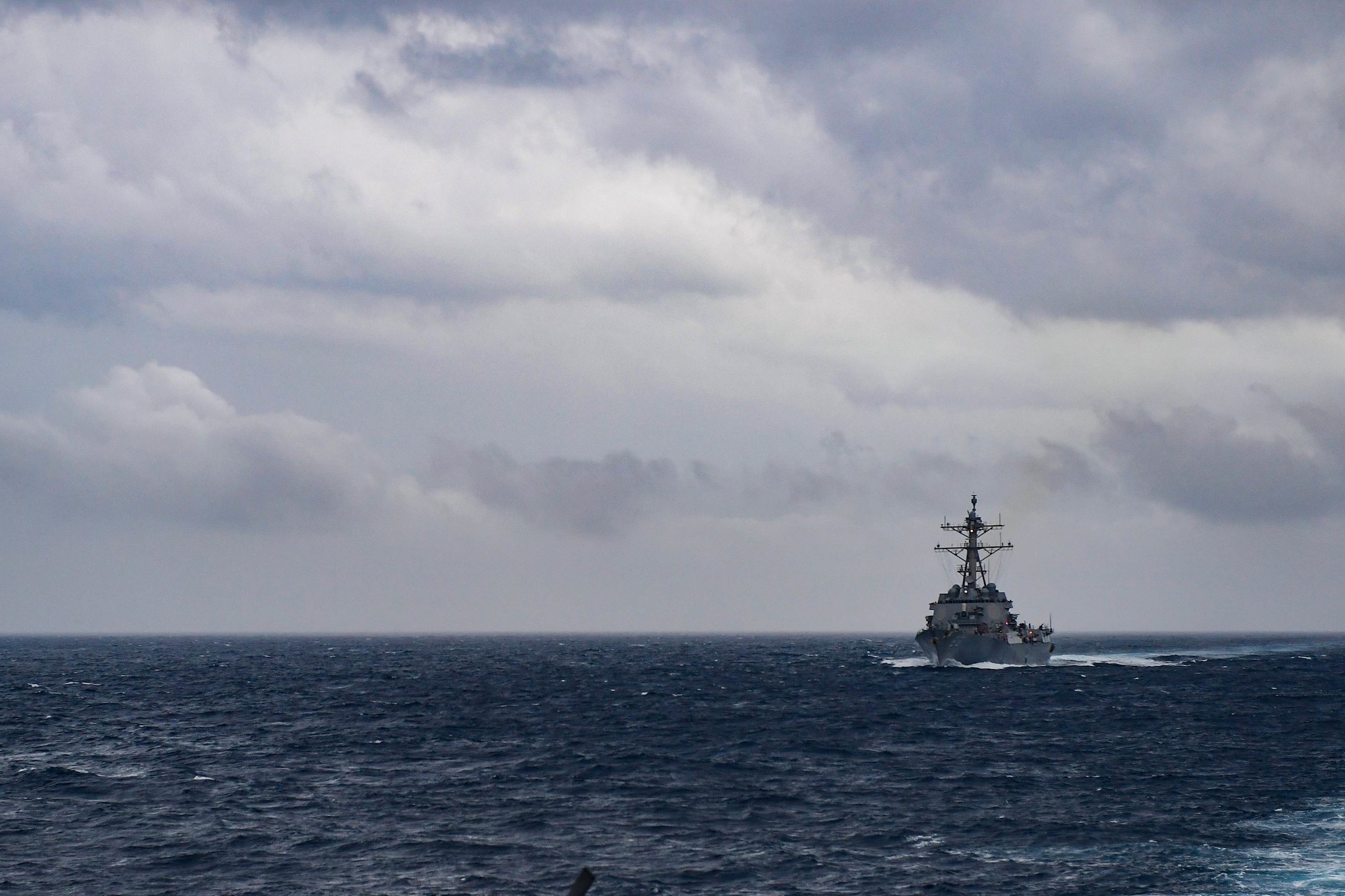The Arleigh Burke-class guided-missile destroyer USS Howard (DDG 83) transits the Bay of Bengal during Malabar 2017.