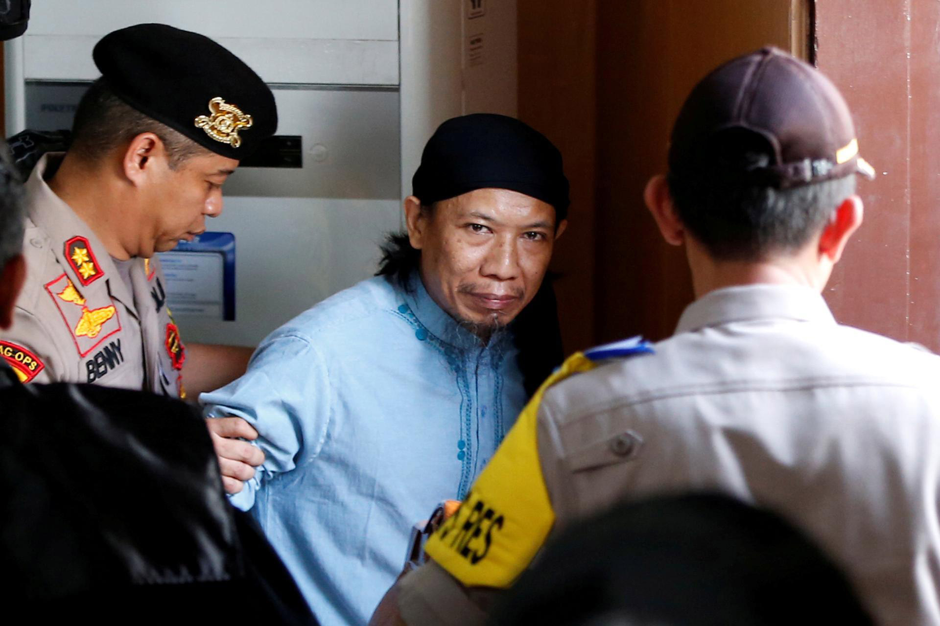 Indonesian cleric Aman Abdurrahman leaves court after death sentence