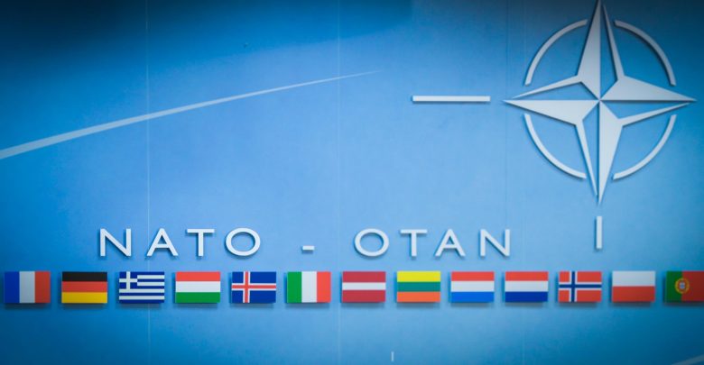 NATO flag backdrop