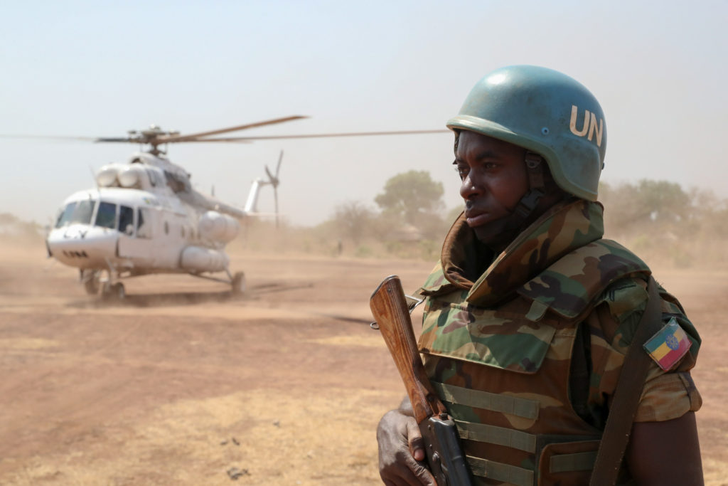 Ethiopian UNMISS peacekeeper guards helicopter