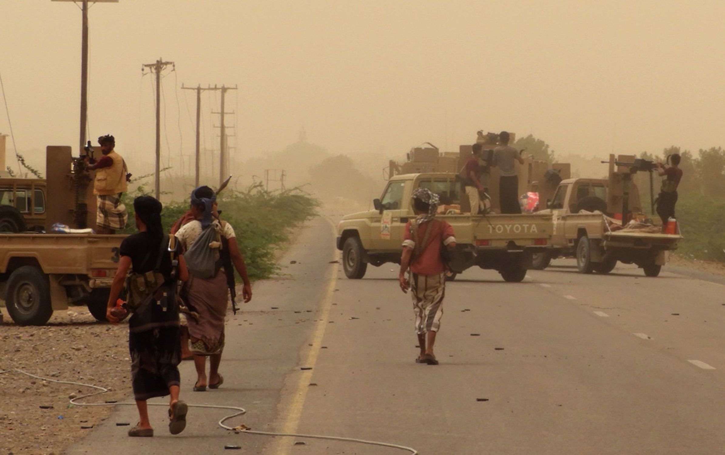 Yemeni pro-government forces gather at the south of Hodeidah airport on June 15, 2018