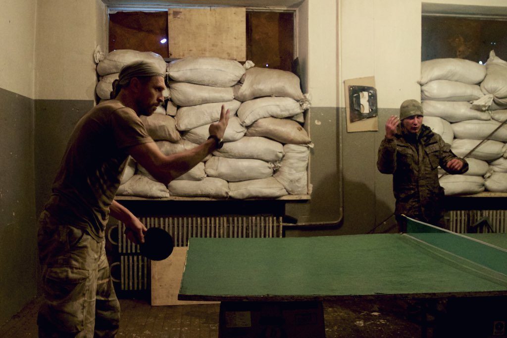 Ukrainian soldiers play table tennis at a frontline base in Avdiivka, Ukraine