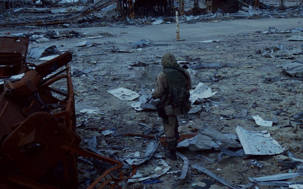 A separatist fighter of the Sparta Battalion walks through the debris of Donetsk Airport, Ukraine