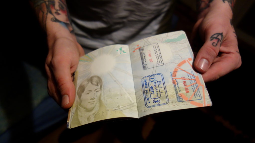 A YPG foreign volunteer shows his 30 day entry visa into Iraqi Kurdistan, from where he crossed into Rojava in northern Syria to fight against ISIS