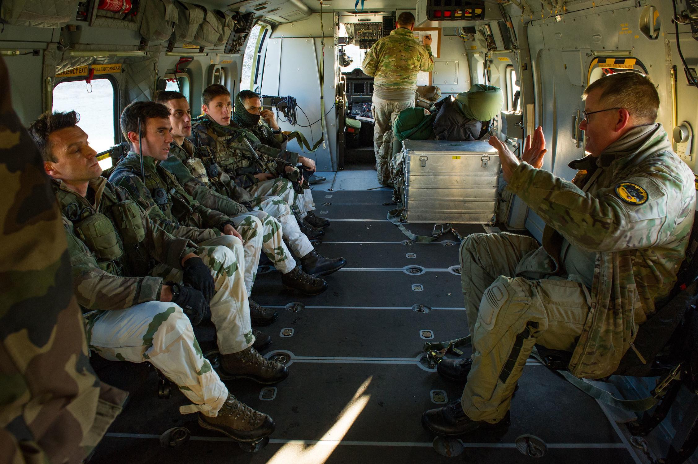 A Danish pilot gives a security brief to French Army troops