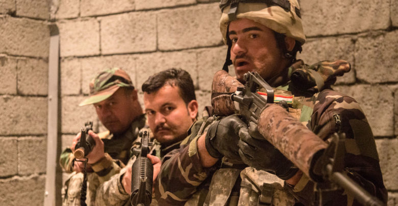 Peshmerga soldiers practice urban room clearing during training at Bneslawa, Iraq