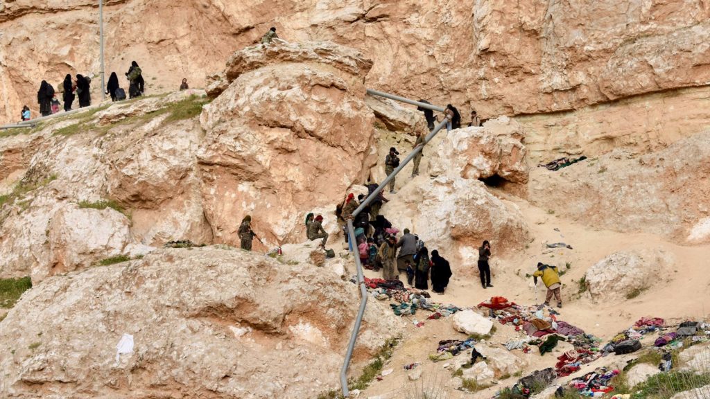 People surrender in ISIS-held Baghuz