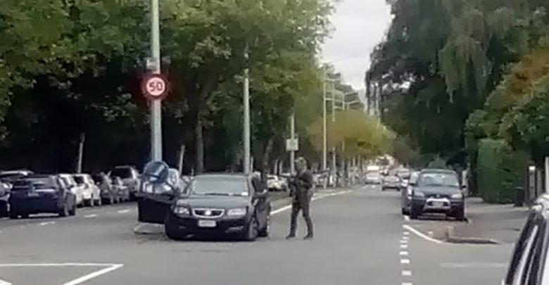 New Zealand police cordon a street near the mosque after a shooting in Christchurch