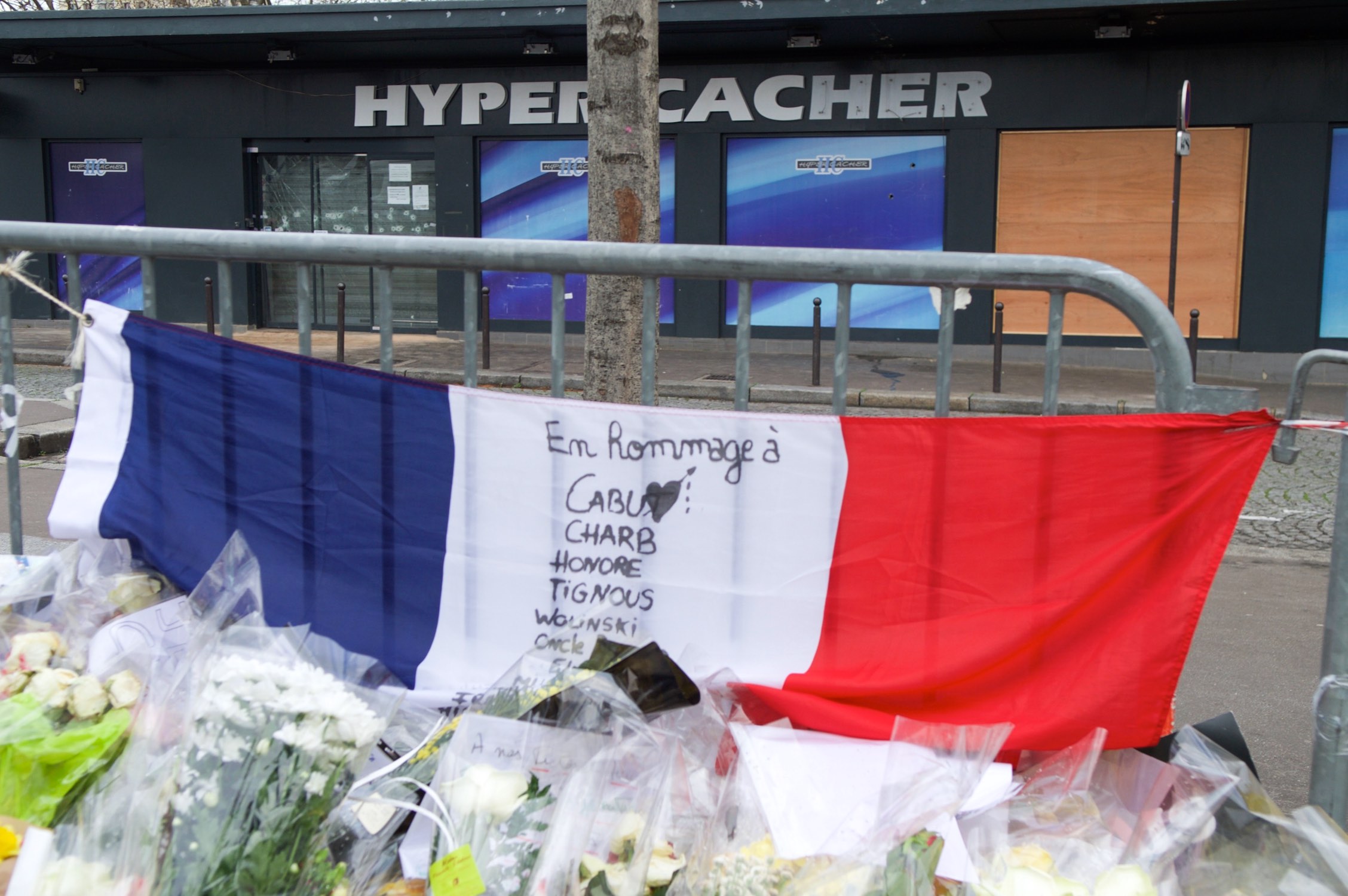 French flag outside the Hyper Cacher kosher market in Paris, France