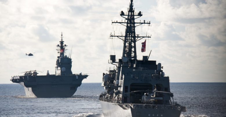 The Japan Maritime Self Defense Force Izumo-class helicopter destroyer JS Izumo and the Murasame-class destroyer JS Murasame