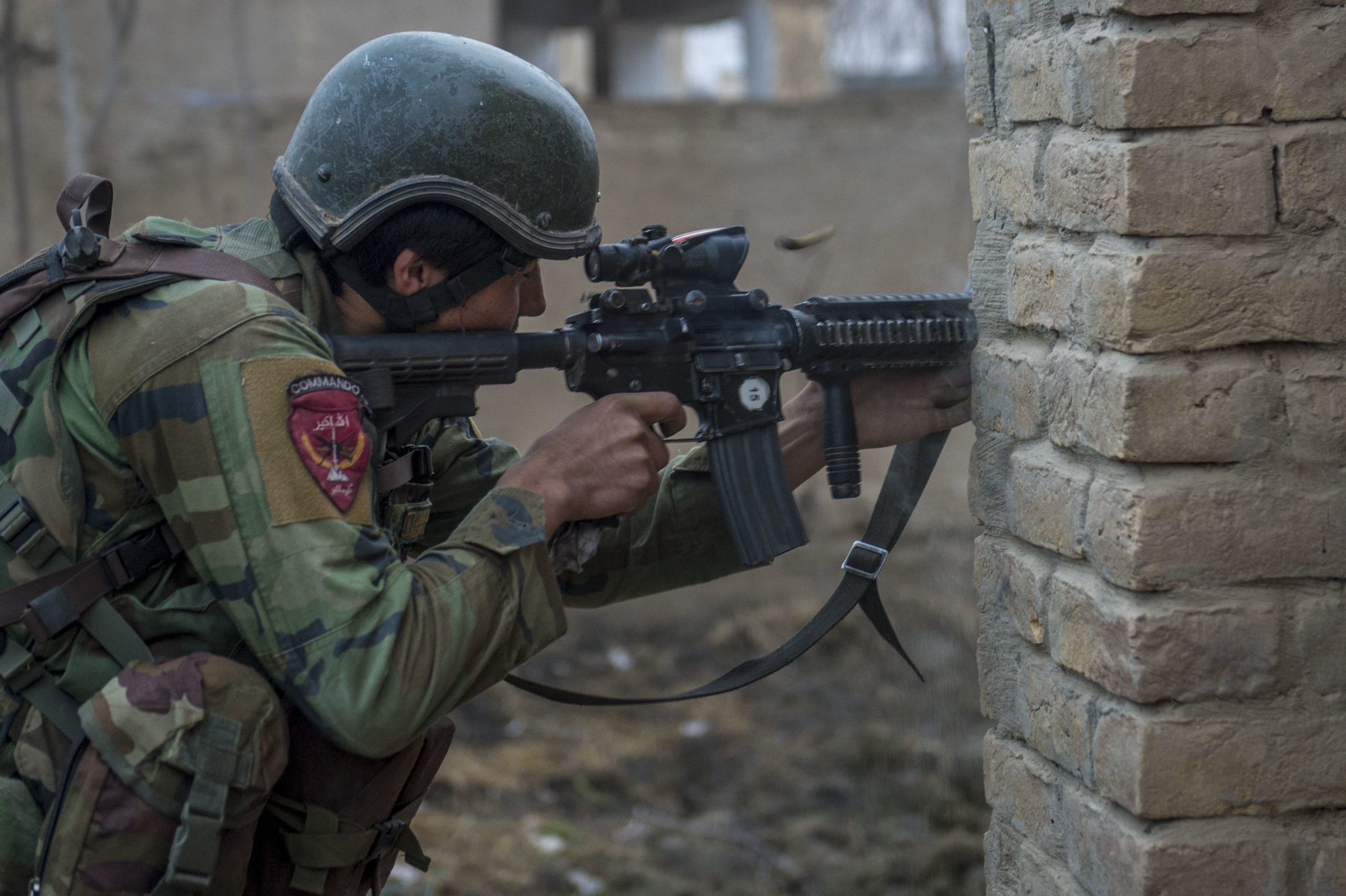 An Afghan national Army 10th Special Operations Kandak Commando returns fire during offensive operations against the Taliban in Kunduz province, Afghanistan, January 20, 2018.