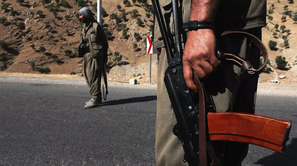 A 2018 file photo shows fighters of the Kurdistan Workers' Party (PKK) manning a roadblock in the Qandil Mountains, the groups's main rear-base in northern Iraq