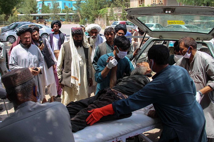 Elderly civilian injured in Sangin marketplace explosions.