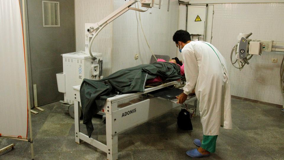 An injured woman is treated at a hospital after an air strike west of Kabul, Afghanistan on July 23, 2020.