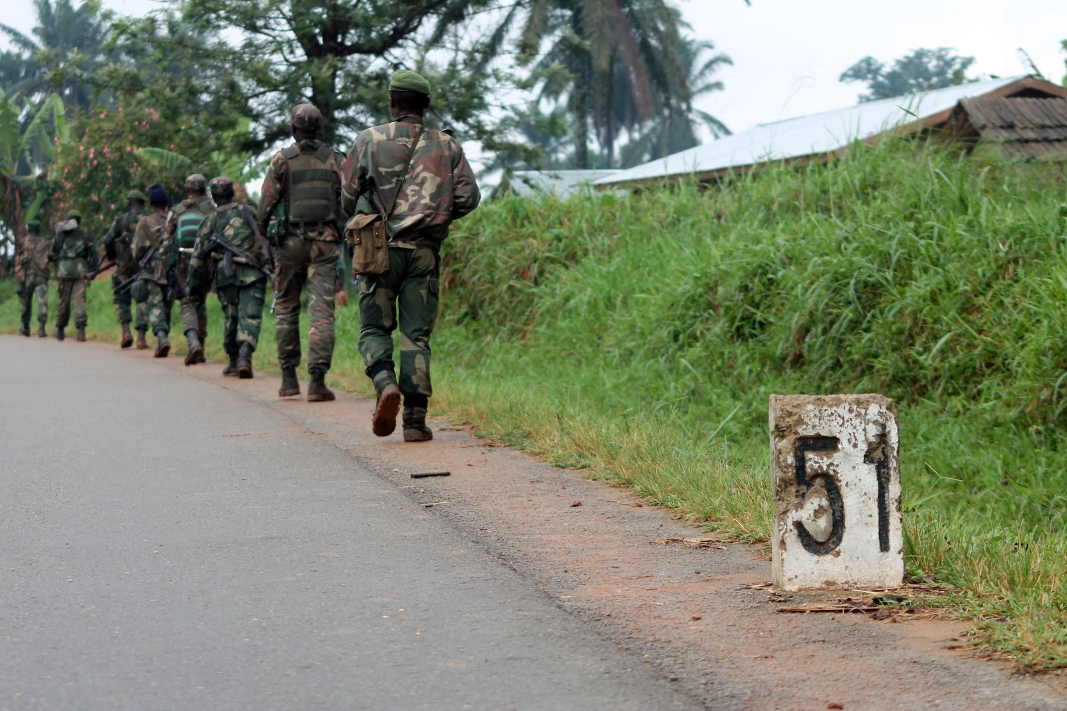 Democratic Republic of Congo soldiers march on December 31, 2013 in Eringeti towards the front line in Beni to fight against the Allied Democratic Forces.