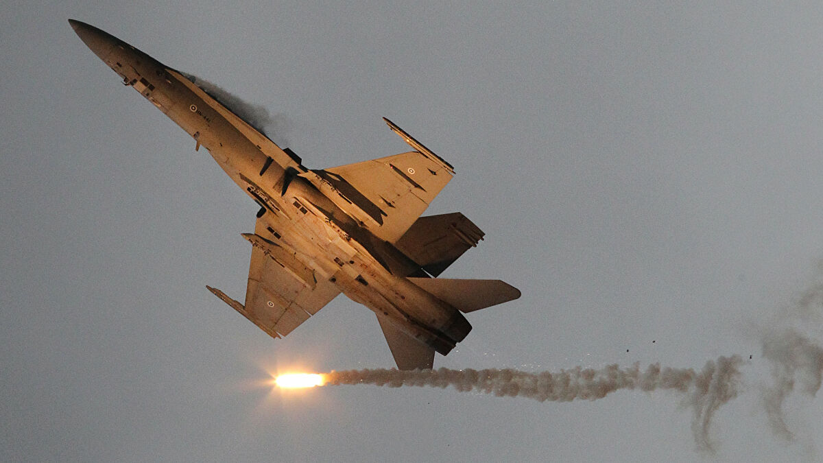 A McDonnell Douglas F-18 Hornet military airplane of the Finnish Air Force emits so-called 