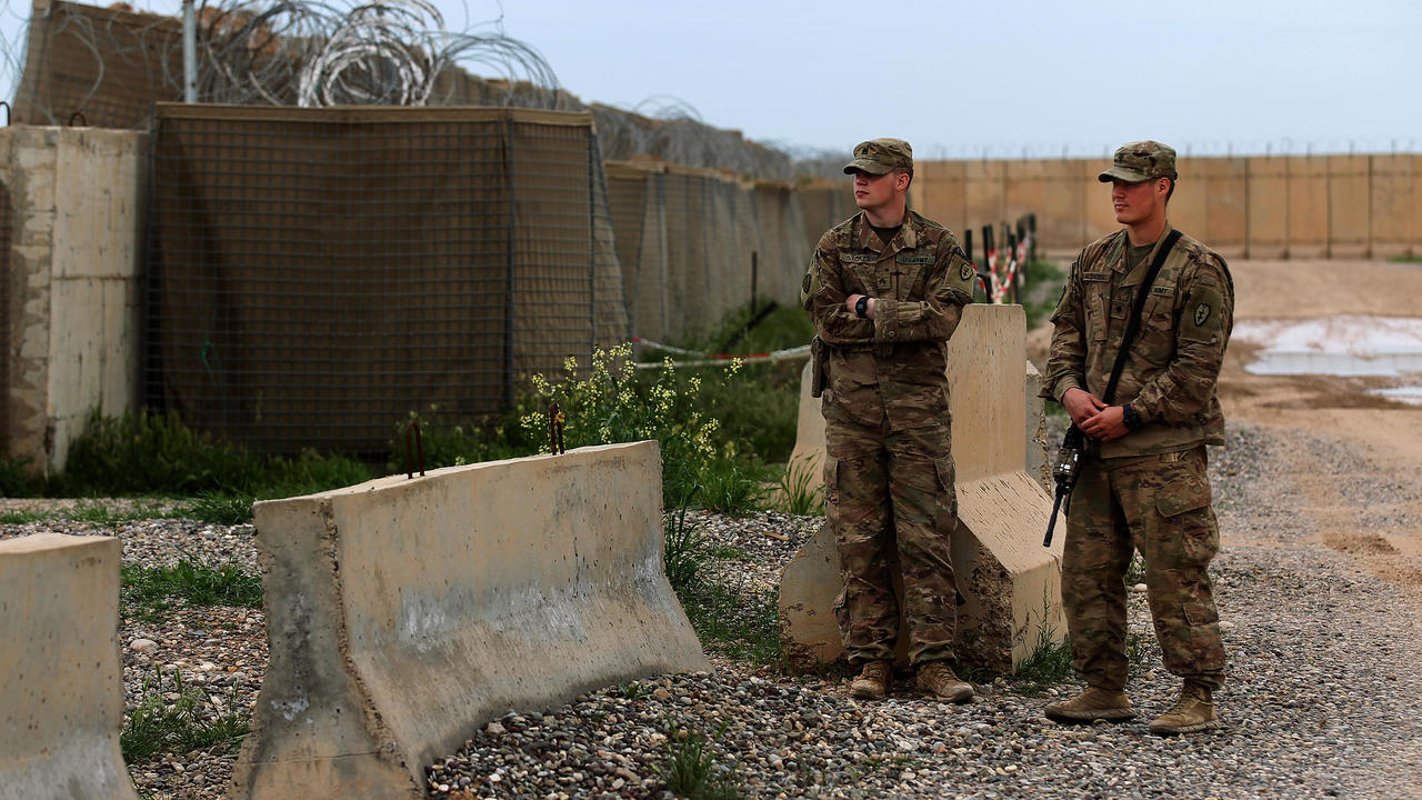 US soldiers stand at the Qayyarah Air Base, where US-led troops in 2017 helped Iraqis plan out the fight against the Islamic State in nearby Mosul