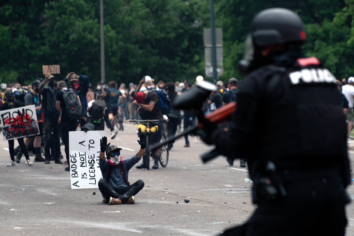 Protester and police