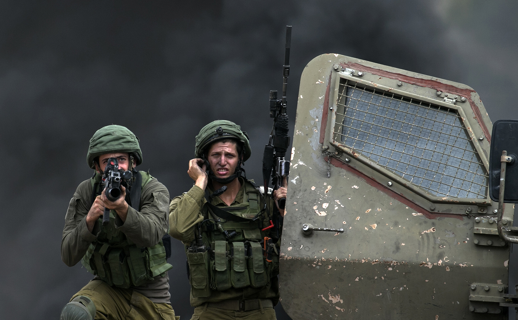 Two Israeli soldiers with armed weapons.