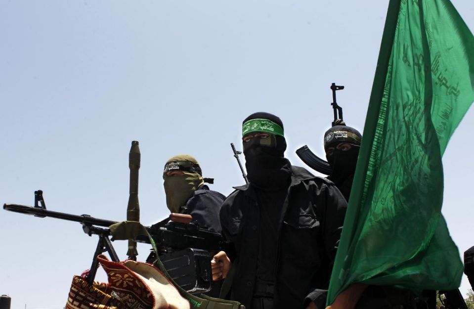 Hamas military personnel set atop military grade vehicles.