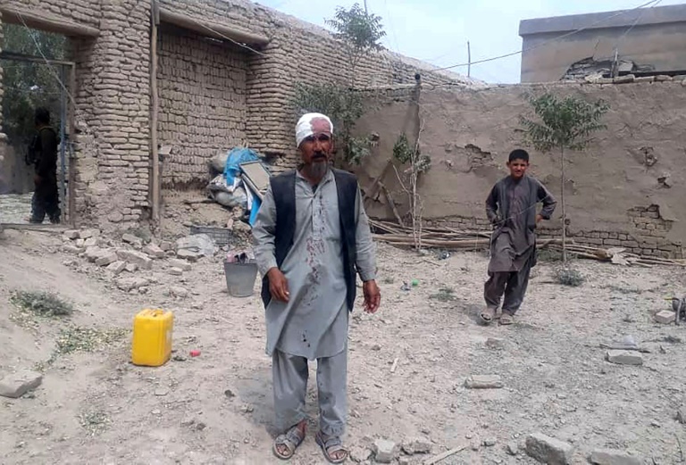 An injured man near the site of a Taliban suicide bombing in Afghanistan's north