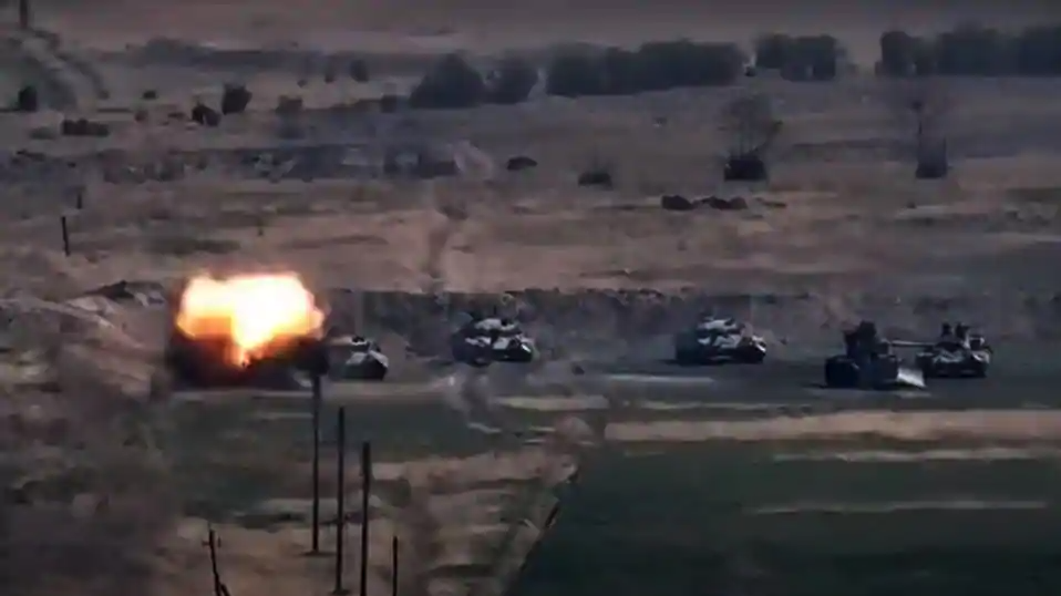 An image grab taken from a video made available on the official web site of the Armenian Defence Ministry on September 27, 2020, allegedly shows destroying of Azeri military vehicles during clashes between Armenian separatists and Azerbaijan in the breakaway region of Nagorno-Karabakh