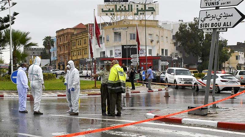 Attackers with knives killed a Tunisian National Guard officer and wounded another before three assailants were shot dead