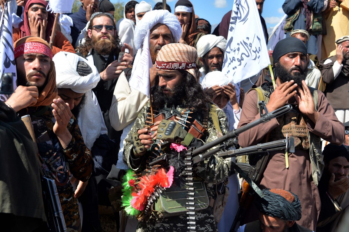 Photo of Taliban militants and villagers attend a gathering to celebrate the peace deal with the US in Afghanistan’s Laghman province on March 2, 2020