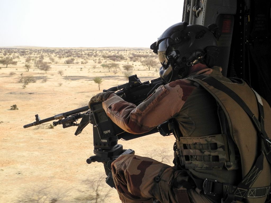 A French soldier aims his rifle at the target.