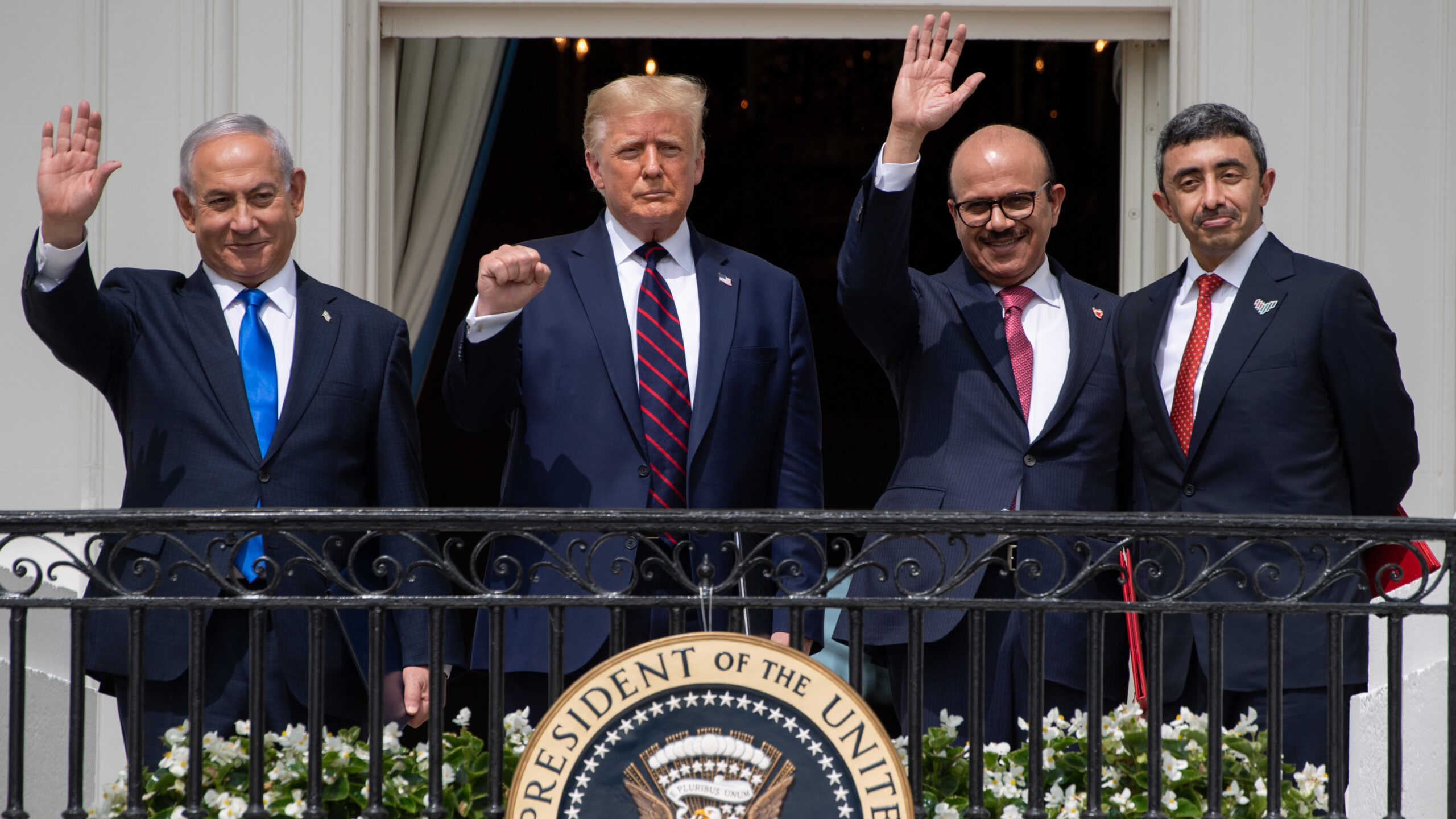 Israeli Prime Minister Benjamin Netanyahu, US President Donald Trump, Bahrain Foreign Minister Abdullatif al-Zayani, and UAE Foreign Minister Abdullah bin Zayed Al-Nahyan wave from the Truman Balcony at the White House after they participated in the signing of the Abraham Accords.
