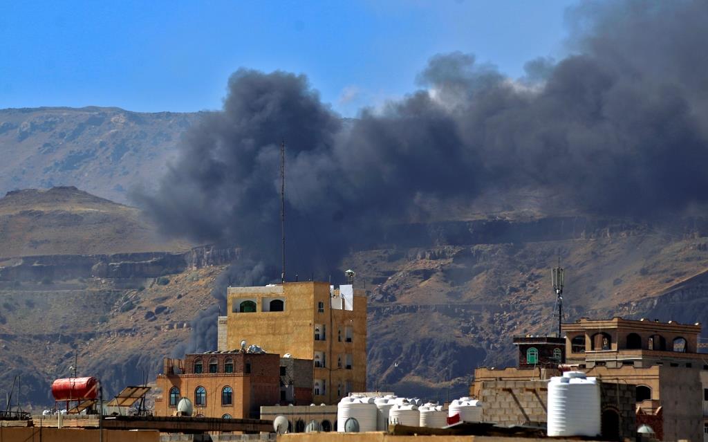 Smoke billows following a reported airstrike by the Saudi-led coalition in the Yemeni capital Sanaa, on November 27, 2020