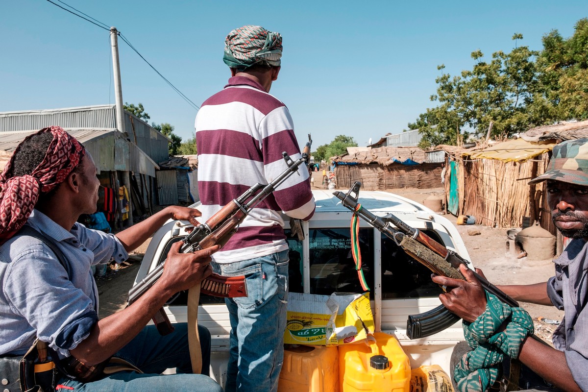 Ethiopian militias ride in the back of a pick up truck in Ethiopia, on 21 November 2020.