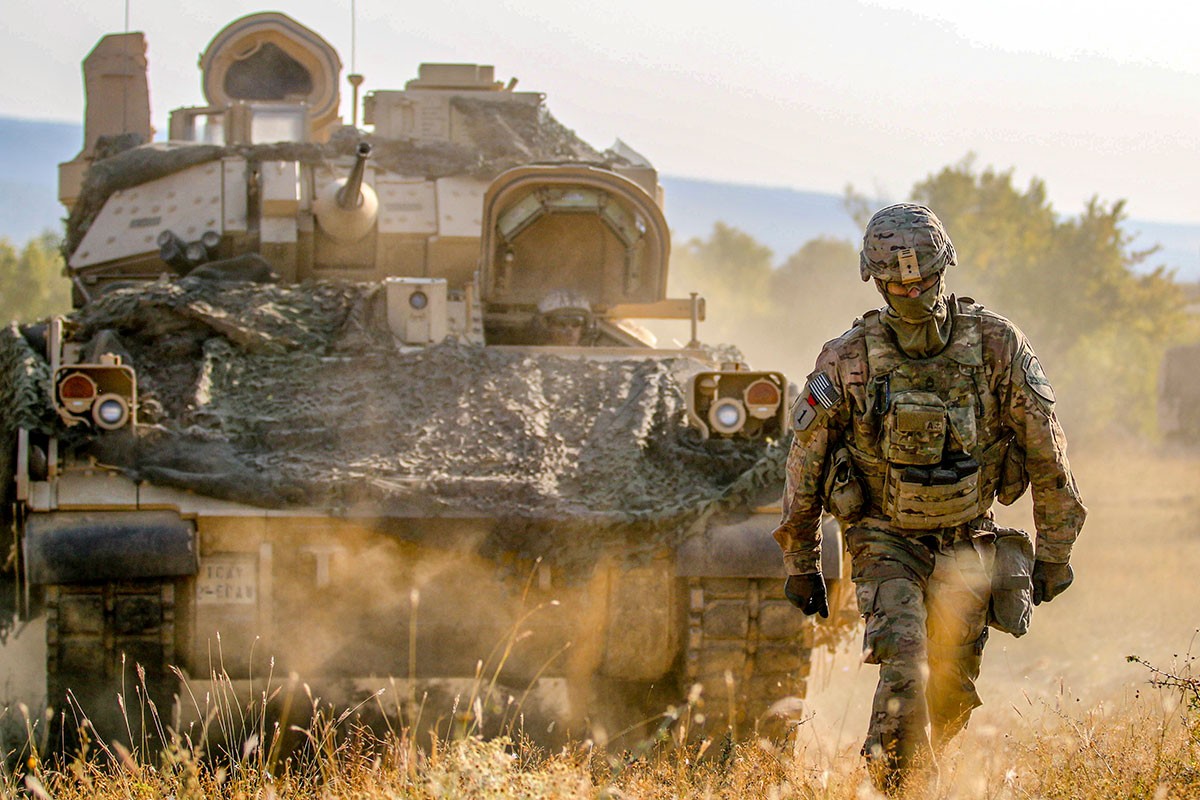 A Soldier guides a M2A3 Bradley Fighting Vehicle during an exercise at Novo Selo Training Area, Bulgaria, Aug. 23, 2018