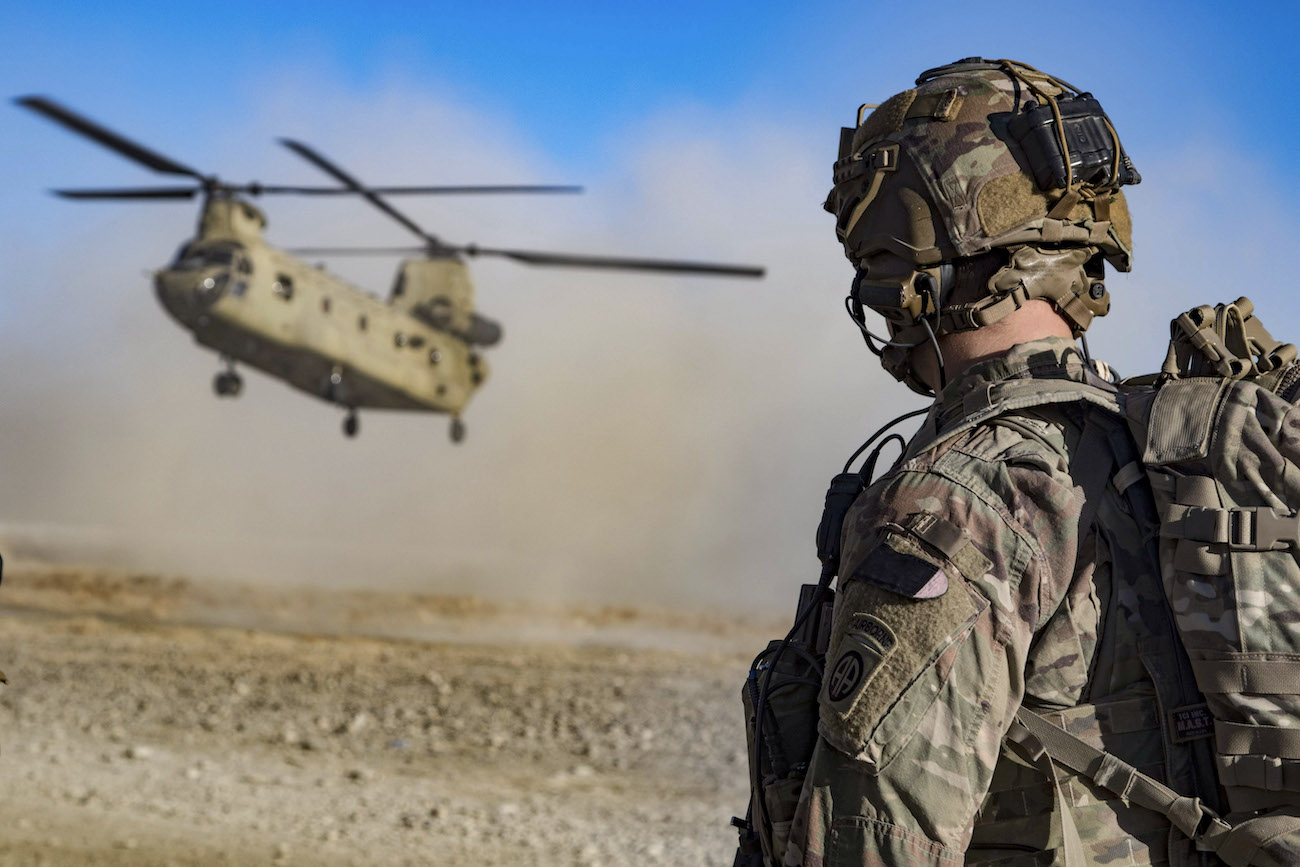 Army Staff Sgt. Jason N. Bobo watches as a CH-47 Chinook prepares to land to provide transport for US and Afghan soldiers after a key leader engagement in southeastern Afghanistan, December 29, 2019