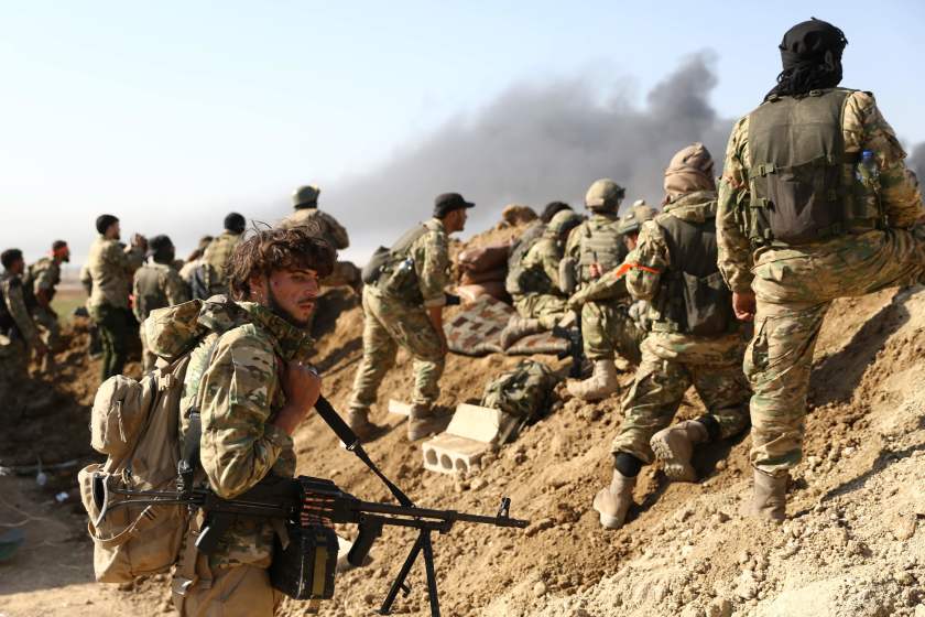 Turkish-backed Syrian rebels and Turkish soldiers in Ras Al Ain, Syria.