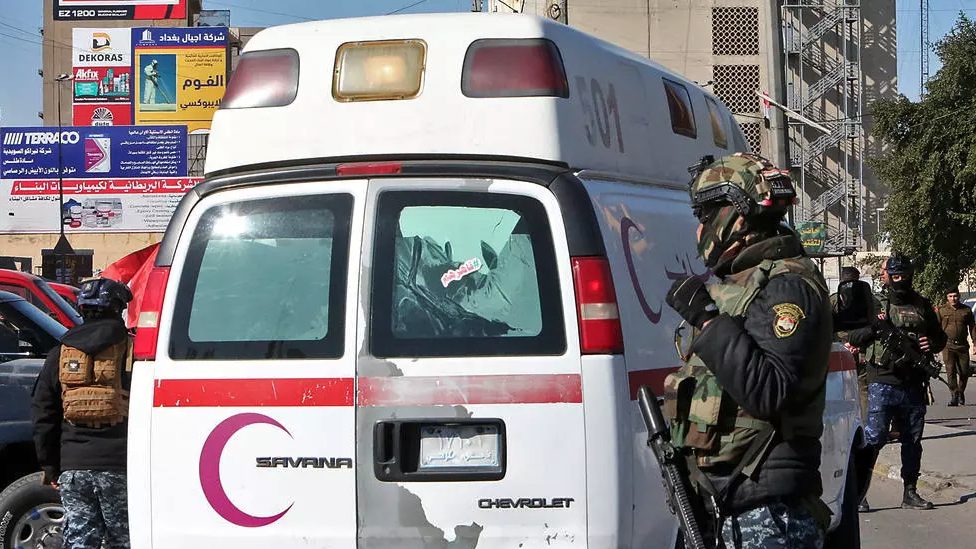 Iraqi security forces at the scene of Thursday's twin suicide bombing.