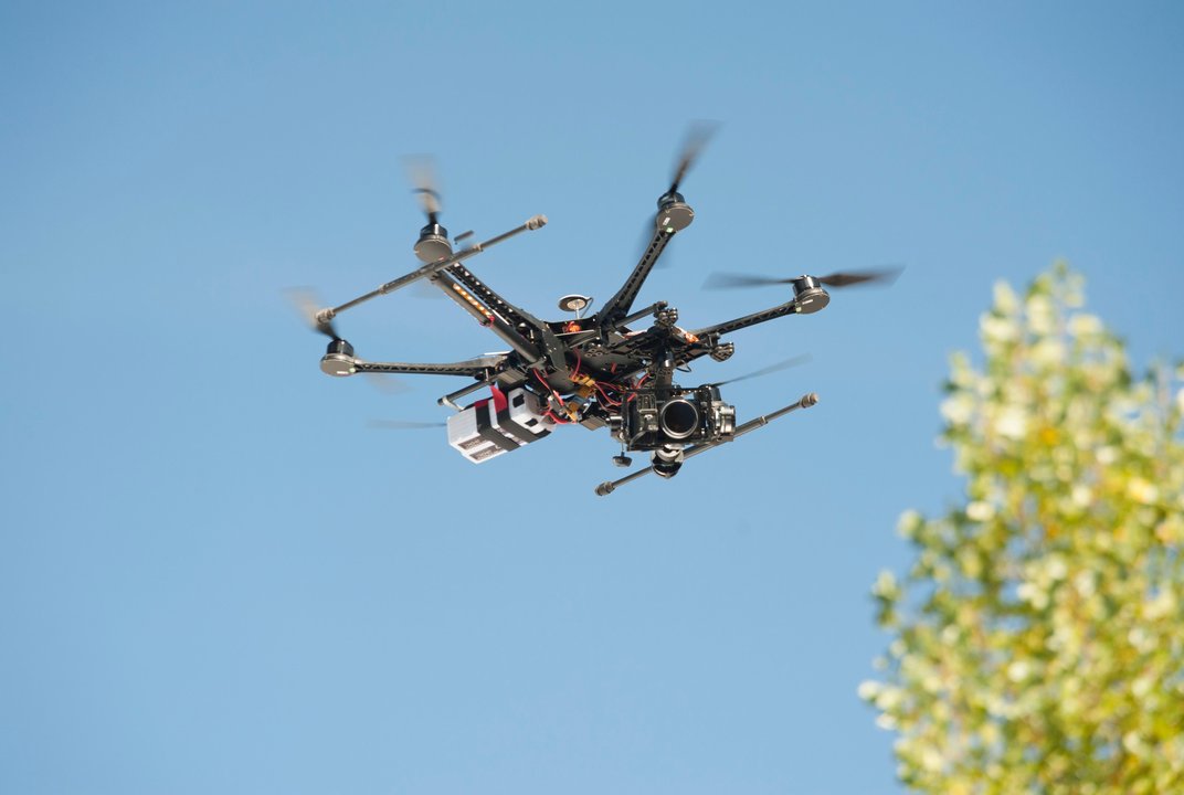 Photo of a small drone hovering.