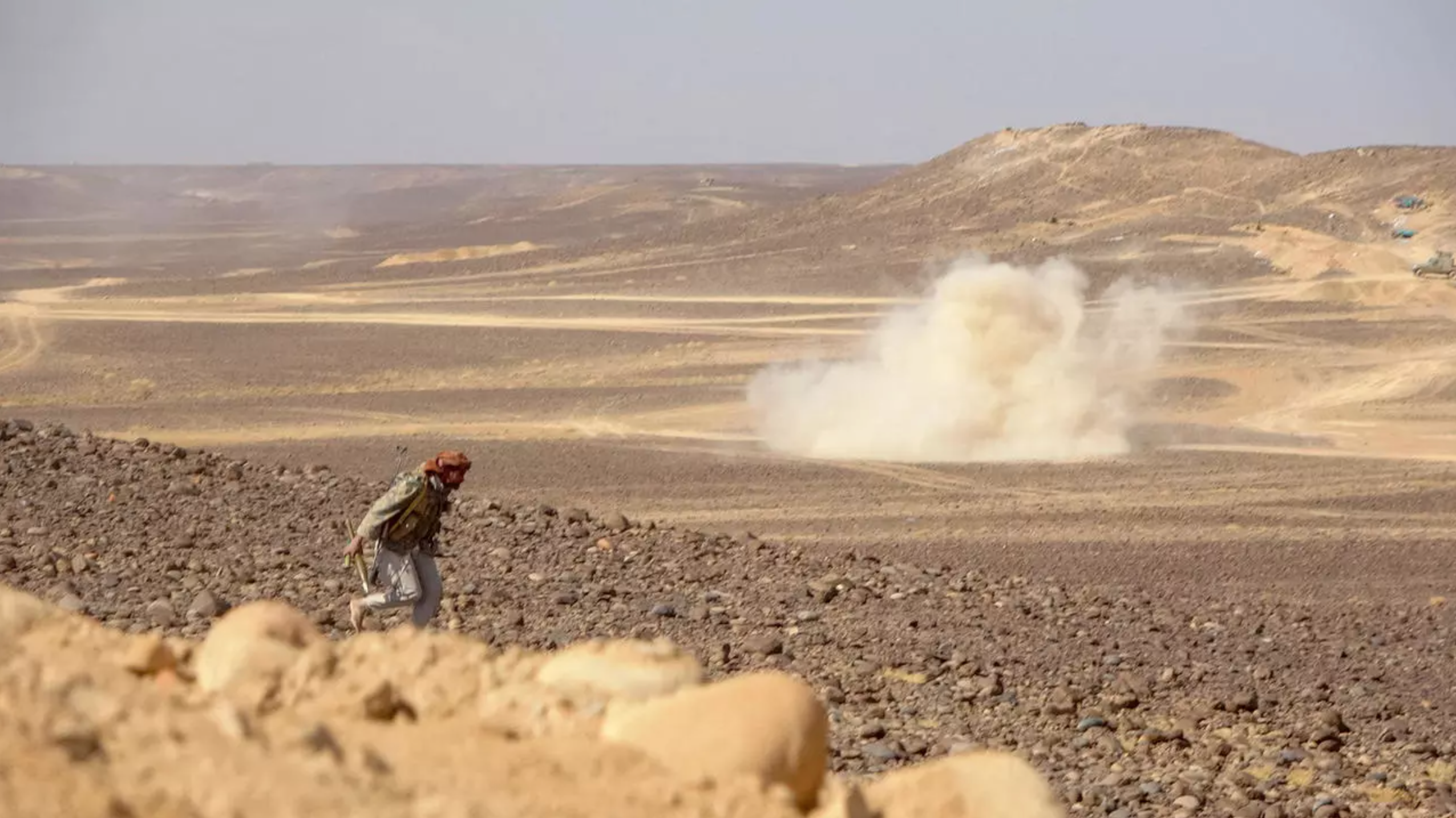 Smoke billows during clashes between forces loyal to Yemen's Saudi-backed government and Houthi rebel fighters in al-Jadaan area 50 kilometres northwest of Marib in central Yemen on February 11, 2021.