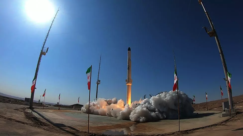 A handout picture provided by Iran's Defence Ministry shows the launch of Iran's newest satellite-carrying rocket, called 