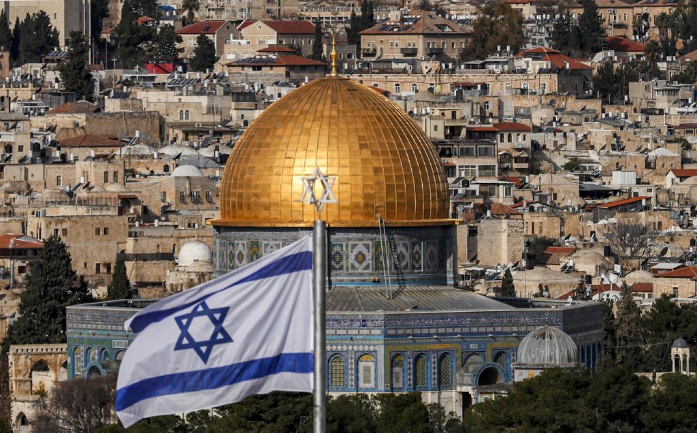 An Israeli flag flies in Jerusalem on 27 January, 2020.