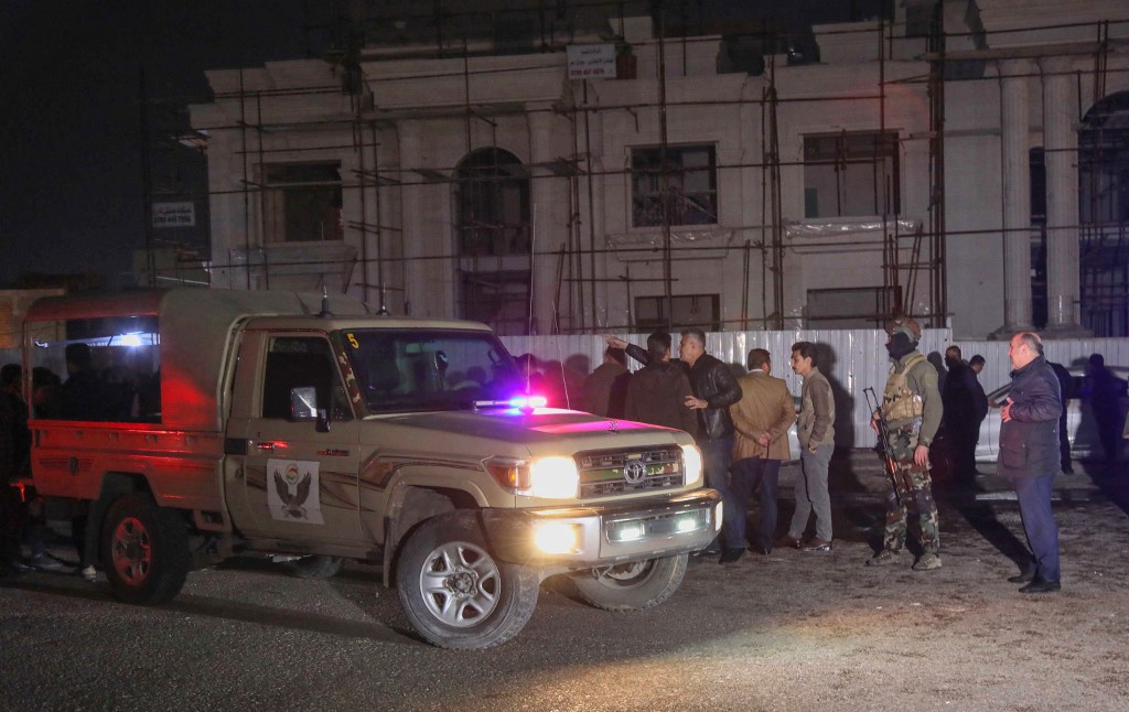 Security forces gather following a rocket attack in Arbil, the capital of the northern Iraqi Kurdish autonomous region, on February 15, 2021