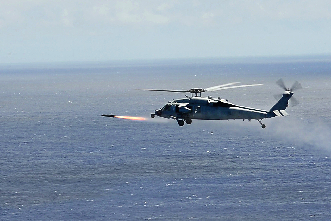 Helicopter fires AGM-114 Hellfire II missile during RIMPAC
