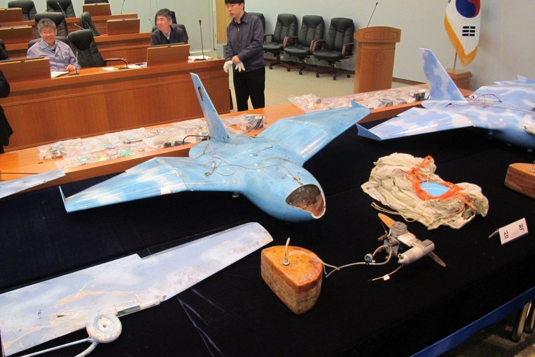three drones on a table